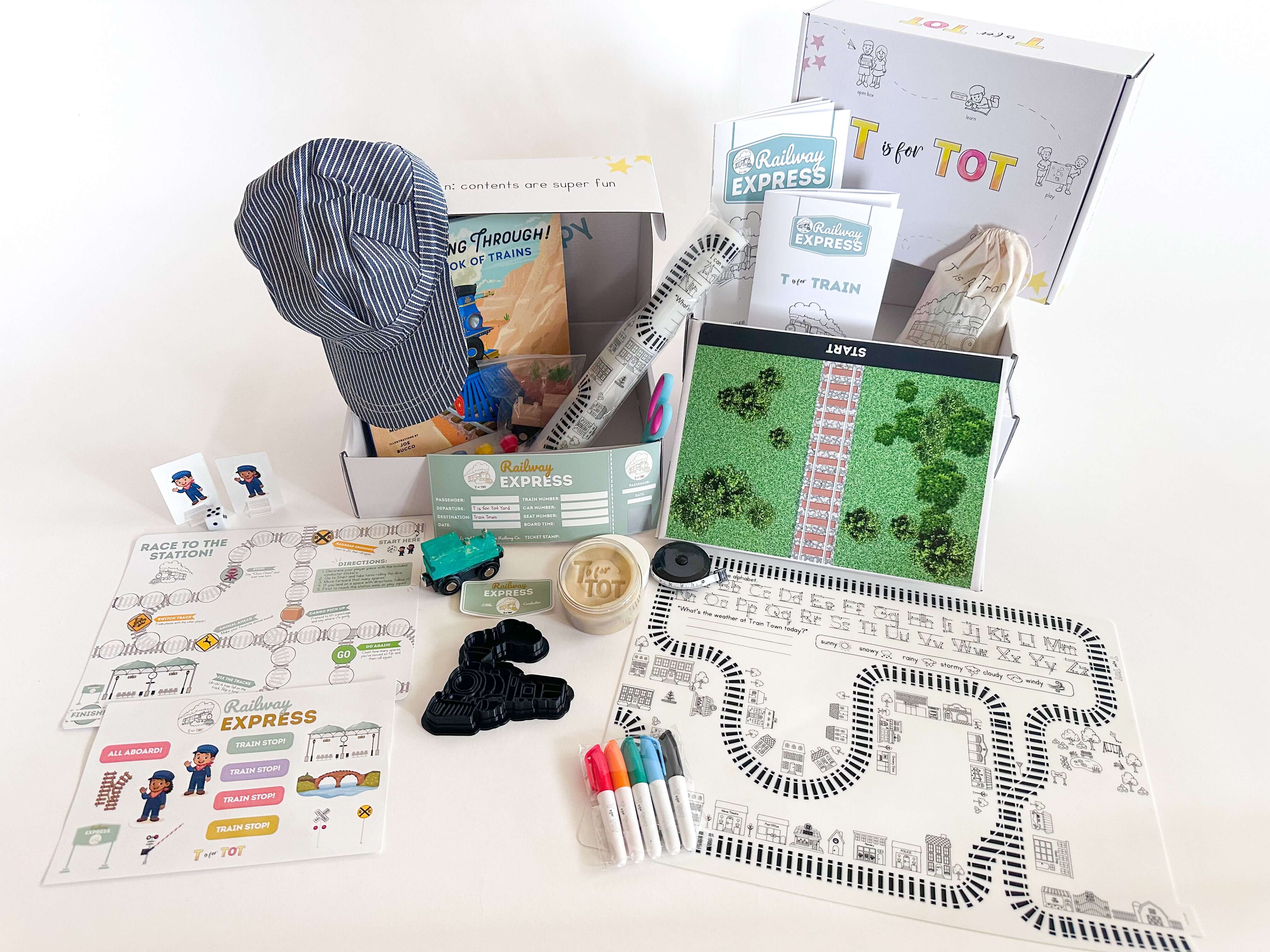 T is for Train Kit featuring toys, activity sheets, and accessories for hands-on learning and play.